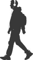 silhouette man walking while listening to headset black color only vector