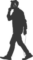 silhouette man walking while listening to headset black color only vector