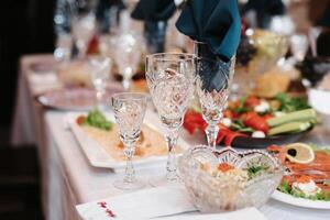festive table in the restaurant with wine glasses photo