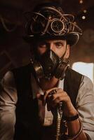 Steampunk cosplay. Portrait of a man in a top hat, glasses and a gas mask photo