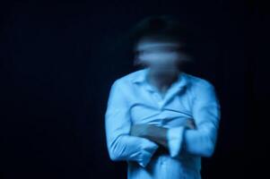 schizophrenic portrait of a man with mental disorders and mental illnesses in a straitjacket photo