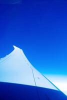 flying and traveling, view from airplane window on wing photo