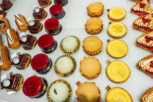 French pastries on display on a confectionery photo