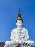 The big white Buddha five statue,Phetchabun is one of the top Thailand famous temples with a huge five white jade buddhas layered statue,Wat Phra That Pha Kaew, Phetchabun,Five white Buddha statue. photo