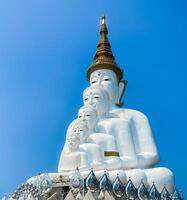 The big white Buddha five statue,Phetchabun is one of the top Thailand famous temples with a huge five white jade buddhas layered statue,Wat Phra That Pha Kaew, Phetchabun,Five white Buddha statue. photo