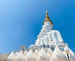 The big white Buddha five statue,Phetchabun is one of the top Thailand famous temples with a huge five white jade buddhas layered statue,Wat Phra That Pha Kaew, Phetchabun,Five white Buddha statue. photo