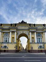 A grand view of the historic archway of the General Staff Building in St. Petersburg, showcasing its architectural details and classical sculptures. Ideal for architecture, history, and travel projects. photo