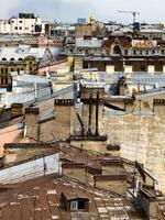 A detailed rooftop view of historic buildings in St. Petersburg, showcasing the intricate architecture and urban landscape. Ideal for travel, architecture, and urban photography projects. photo