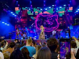 Captivating live performance by Moya Mishel at the STEREOLETO Festival in Saint Petersburg, Russia, on June 15, 2024. The stage was alive with vibrant lights, energetic music, and an enthusiastic crowd. photo