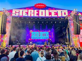 Vibrant crowd enjoying the STEREOLETO Festival in Saint Petersburg, Russia, on June 15, 2024. The event showcases live music, colorful stage designs, and a lively atmosphere. photo