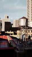 view of skyscraper rooftops at sunset in a big city video
