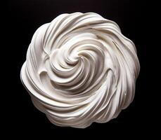 Whipped cream on black background, top view photo