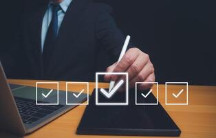 Businessman checks transaction documents or electronic contract documents, Check electronic documents on digital documents and checklist approval, Prepare check and approve concept. photo