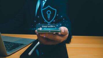 Cyber security technology concept, Businessman use phone and computer online showing protection icons cyber espionage, Represents the code protection, Security concept and communication technology. photo