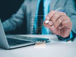 Business people use computers to analyze business and manage corporate data, business analytics with charts, metrics and KPIs to improve organizational performance, financial organization strategy. photo