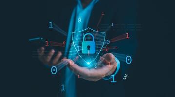 Businessman showing key and symbolic shield represents protection against cyber attacks and online hacking, Protection against external hacks, Cybersecurity and privacy concepts to protect data. photo