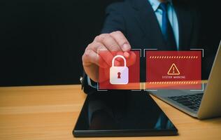Businessman working on tablet and computer online showing protection icons cyber espionage, Represents the code protection, Security concept and communication technology. photo