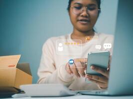 Business women holding smartphone with a checked box on Excellent Smiley Face and Rating for a satisfaction survey, Evaluation of product service quality by customers, Positive customer feedback. photo
