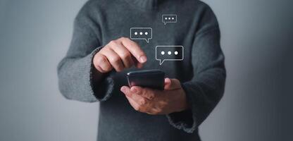A Man using smartphone typing live chat chatting on application communication digital web and social network concept, Social media application chat box. photo