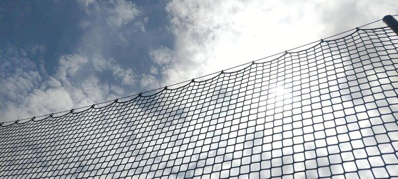 Rope net. String net on sky background, sports inventory photo