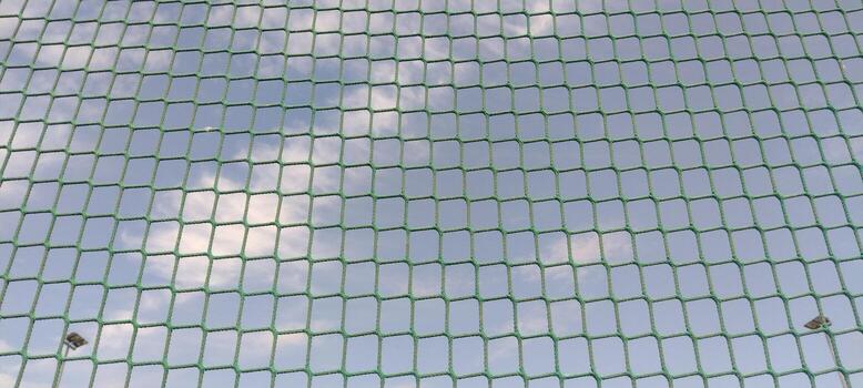 Rope net. String net on sky background, sports inventory photo