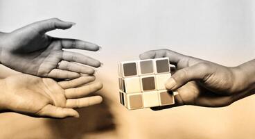 CENTRAL JAVA, INDONESIA. April 25th, 2024 - Man holding rubik's cube. The Rubik's Cube puzzle on white background morning sunlight concept. photo