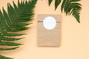 A mock-up of a round sticker on a gift craft package photo