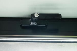 Window handle with secure lock with key photo