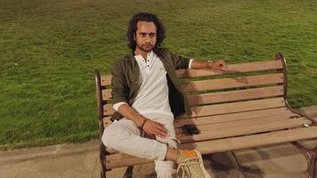 Man sitting on a bench with thoughts video