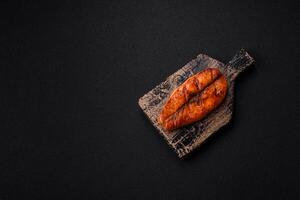 Fresh cooked delicious salmon steak with spices and herbs photo