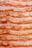 Delicious bacon in the form of slices with salt, spices and herbs photo