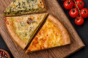 Delicious quiche with broccoli, chicken or salmon and cheese photo
