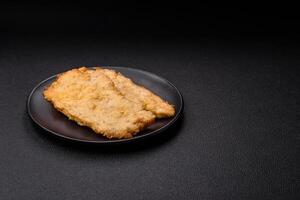 Delicious juicy chicken chops in batter with salt, spices and herbs photo