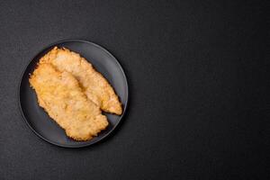 Delicious juicy chicken chops in batter with salt, spices and herbs photo