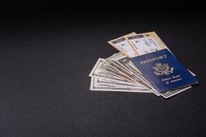 United States of America passport, airline tickets and money photo