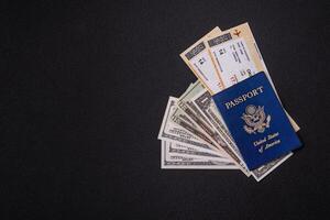 United States of America passport, airline tickets and money photo