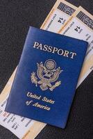 United States of America passport, airline tickets and money photo