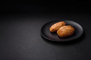 Delicious fresh fried minced cutlets with spices and herbs photo