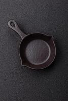 Beautiful empty white ceramic gravy boat on a concrete background photo