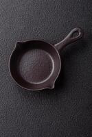Beautiful empty white ceramic gravy boat on a concrete background photo