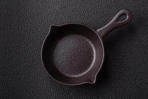Beautiful empty white ceramic gravy boat on a concrete background photo