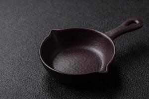 Beautiful empty white ceramic gravy boat on a concrete background photo