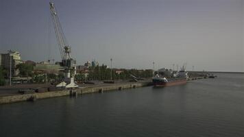 Porto, Portugal. Cargo port with cranes and workers in sunny weather in Oporto. Loading terminal with cargo ships view from the bridge. Global business logistic and transportation. video