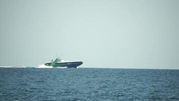A high speed boat is sailing in the calm ocean. video