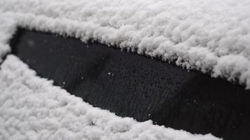Snow covered car. Fresh snow on car in cold winter morning. Concept of driving in winter time with snow on road. Winter season. Copy space. video