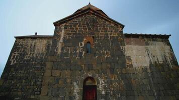 Ancient wooden castle. ACTION. Old stone gate in the old city. The wooden church stands in the middle of the steppe video