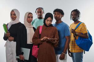 Group of diverse students engages in modern educational practices, utilizing a variety of technological tools such as laptops, tablets, and smartphones against a clean white background, exemplifying photo