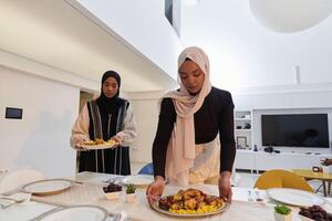 Group of young Arab women come together to lovingly prepare an iftar table during the sacred Muslim month of Ramadan, embodying the essence of communal unity, cultural tradition, and joyous photo