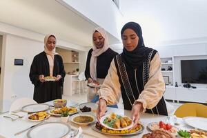 Group of young Arab women come together to lovingly prepare an iftar table during the sacred Muslim month of Ramadan, embodying the essence of communal unity, cultural tradition, and joyous photo
