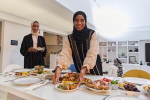 Group of young Arab women come together to lovingly prepare an iftar table during the sacred Muslim month of Ramadan, embodying the essence of communal unity, cultural tradition, and joyous photo